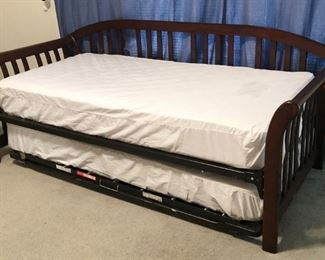 Traditional dark-stained hardwood daybed with trundle