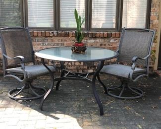 Pair of outdoor patio chairs and glass top