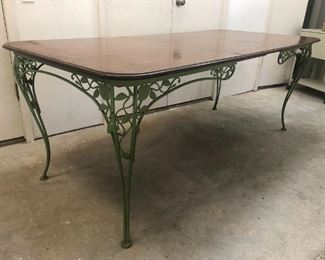 Green painted wrought iron patio table with 2 leaves