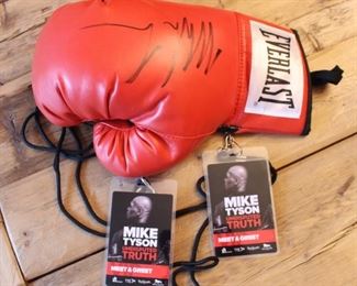 Mike Tyson Autographed boxing glove and passes. $150.00.