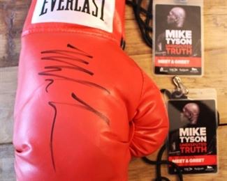Mike Tyson Autographed boxing glove and passes. $150.00.
