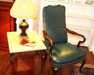 Rectangular marble top side table. $125.00               Leather armchair. Whitmore-Sherrill Limited.  $175.00