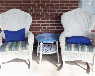 Pair of outdoor "wicker" rockers sold with cushions and pillows.