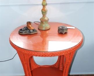 Orange wicker round glass top table. $75.00.