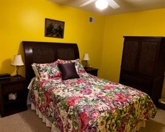 Dark rattan queen set with headboard and frame, two nightstands and armoire with shelf and drawers. No mattress