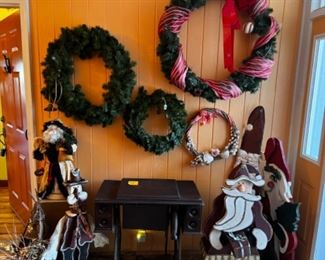Several 3’ tall wooden Christmas decorations, wreaths etc. antique sewing machine.