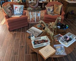 PAIR OF SWIVEL ROCKING CLUB CHAIRS...ROUND TEAK COFFEE TABLE, VINTAGE PIPES, LARGE BRASS GIRAFFES