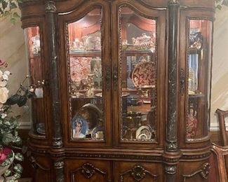 Just look at this amazing lighted hutch with marble pilasters! Proudly display your treasures.