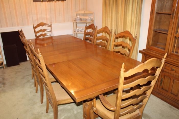 Thomasville solid-wood dining table, 104" as shown with three leaves. 68" w/o leaves. Seats Ten. 11 Chairs