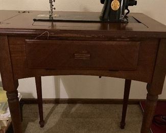 Classic vintage Singer sewing machine and cabinet.  Circa 1945.  Worked perfectly when last used years ago.  Includes button holer.  Will need cleaning and service.  This machine will outlast us all!  