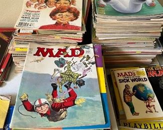 Three stacks of vintage Mad Magazines