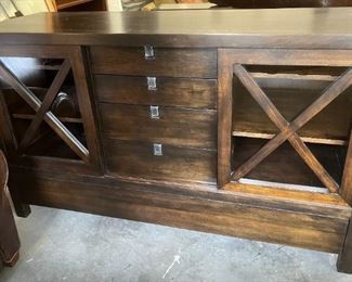 Wood buffet with wine shelf behind each sliding door