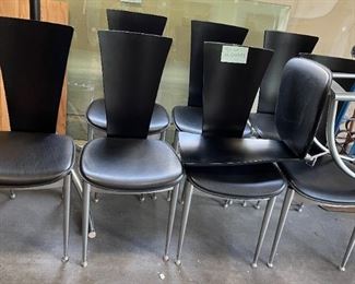 Set of 8 unmarked post modern Italian dining room chairs - chrome, leather and wood.  We have a matching table, but the glass top has a rim chip
