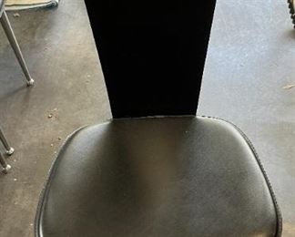 Front: leather seat, lacquered plywood back with chrome accents on back