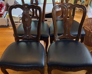 Four Leather Upholstered dining room chairs