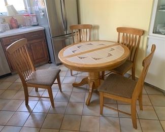 Tile Top Round Table with matching Set of $ Chairs