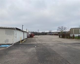 Continue forward to the left you will see the warehouse. Make a left at the corner. 