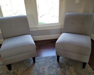 2 light gray slipper chairs