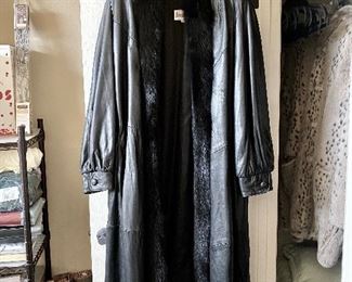 Fur trimmed full length leather coat