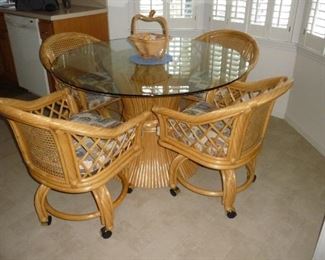 4 chairs on rollers / round glass top table