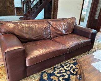 matching leather sofas and chairs by Van Den Bergh’s South Africa. Leather is Kudu Antelope. Each sofa measures 4’6”deep 7’9” wide 34” tall (rugs not for sale)