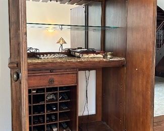 Inside of Large scale wet bar cabinet by Drexel Heritage. bottom right hand corner can accommodate a mini fridge/ wine cooler. Measures 9’3” tall 4’9” wide 2’5” deep