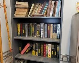 #1526 • Metal Book Shelf with Automotive Manuals