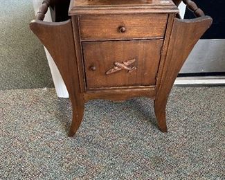 Small humidor table for tobacco with airplane on door
