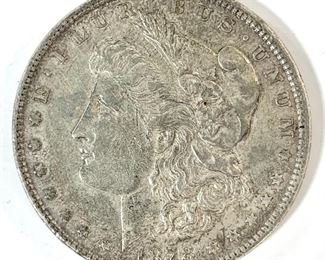 1878 Morgan Silver Dollar 7 Feather Variety - The coin was struck at the Philadelphia mint in 26.73g of .900 silver. The coin is a 7 feather example that has an eagle with 7 tail feathers on the reverse