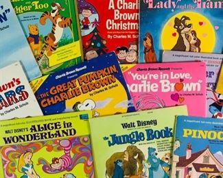 Many Vintage A Disneyland Records and Vintage Charlie Brown Records - Walt Disneys Lady and The Tramp, Alice In Wonderland, The Jungle Book, Pinocchio, Bambi, Winnie the Pooh and Tigger Too, And Mother Goose Nursery Rhymes, and Charlie Brown Records A Charlie Brown Christmas, Youre In Love Charlie Brown, Its The Great Pumpkin Charlie Brown, Hes Your Dog Charlie Brown, and Charlie Browns All-Stars, All Records Have Vinyl In Very Good Condition, All Records Have Colored Book, Some Ripped and Detached, But All In Fairly Good Condition
