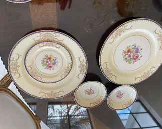 This set is  Vintage  from Tiffany we have  10 plates 10inches, 10 soup plates 5" ,10 small  round 5 " ,9 small plates 6", 12 saucers 6", 12 cups, gravy bowl, Milk and sugar, vegetable platter 16 inches  top and bottom fruit dish 9-1/2 inches