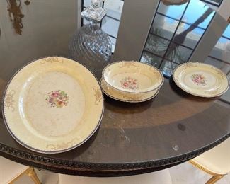 This set is  Vintage  from Tiffany we have  10 plates 10inches, 10 soup plates 5" ,10 small  round 5 " ,9 small plates 6", 12 saucers 6", 12 cups, gravy bowl, Milk and sugar, vegetable platter 16 inches  top and bottom fruit dish 9-1/2 inches