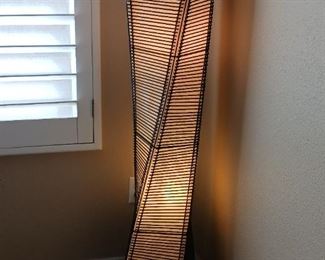 Adesso lighted floor lantern, cane stick and fabric like beige paper.