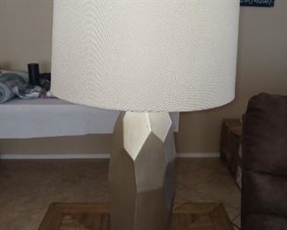 Silver toned contemporary lamp.  32" tall.