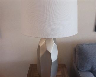 Silver toned contemporary lamp.  32" tall.
