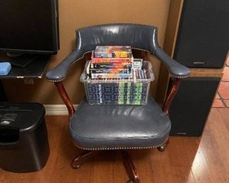 VHS, DVDs, speakers, monitor, nice leather chair