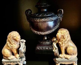 51. Pair of Seated Lion Bookends (4" x 3" x 6")                     69. Black Stone Lidded Urn w/ Ram Head Handles (14")