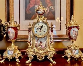 70. 3pc Gilt Mantle Clock Set (Clock 16" x 9") (Pair of Urns (12" x 6")