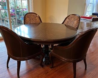 60 in round dark oak pedestal table and 4 upholstered arm chairs 