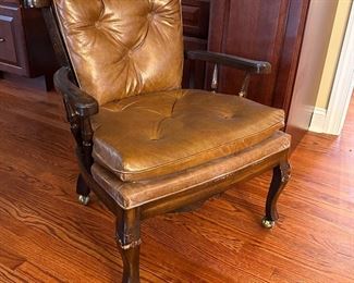 Leather rolling arm chair 