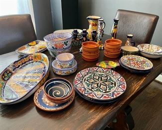 Lot 003-LR: Colorful Artisan Pottery Collection

Features: s
•	The majority of the collection is signed and identified as having been made in Mexico
•	Some items were made by our client and signed “Mimi Shimmin”

Dimensions: 
For perspective:
•	Large oval dish is 17”L x 9”Wx 2”H
•	Planter is 9”L x 4”W x 4”H

Condition: Varies. Generally Good pre-owned condition; some items have small visible chips or imperfections.

