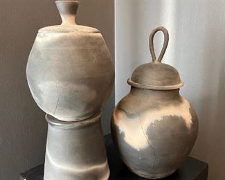 Lot 004-DR: Artisan Pottery Duo

Features: 
•	Created and signed by artist Margaret Cardwell
•	Matte finish. Significant cracks (please refer to photos). Very beautiful and fragile. For display only.
•	The pedestal stand/base is hollow and has a heavy cardboard stock glued to the bottom.

Dimensions: 
•	Jar #1: 8”D x 13”H
•	Jar on pedestal base: 6 ½”D x 9”H; base is 6”D and 6 ¼”H. 


Condition: Very fragile; significant cracks, but items are useable for display only. 





