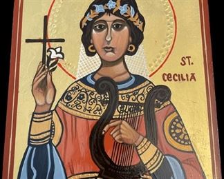 Lot 063-I: Saint Cecelia

Features: 
•	Hand-painted/varnished religious icon on wood
•	Created (“written”) and signed/dated by our client

Dimensions: 10” x 12”

Condition: Very Good condition


