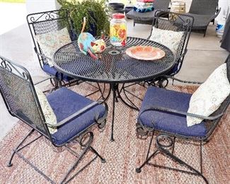 Vintage wrought iron mesh patio table with 4 spring chairs