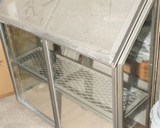 Greenhouse pop out window