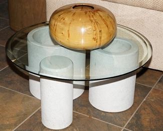 Unique cylindrical base glass topped coffee table. 