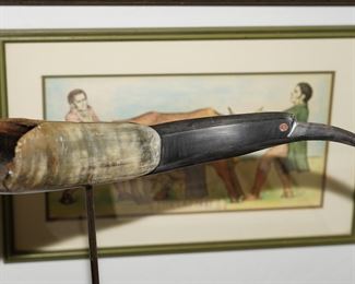 Carved toucan horn sculpture