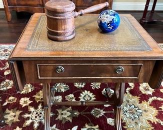Leather and wood side table with brass claw feet.  England. 