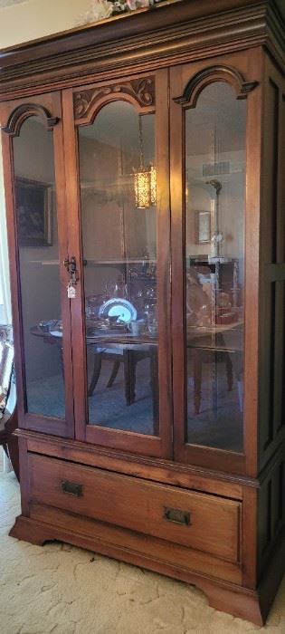 Antique wardrobe converted to curio cabinet. The wood panels are available to restore to wardrobe.
