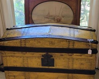 Antique yellow trunk. Antique frame possible watercolor of ships